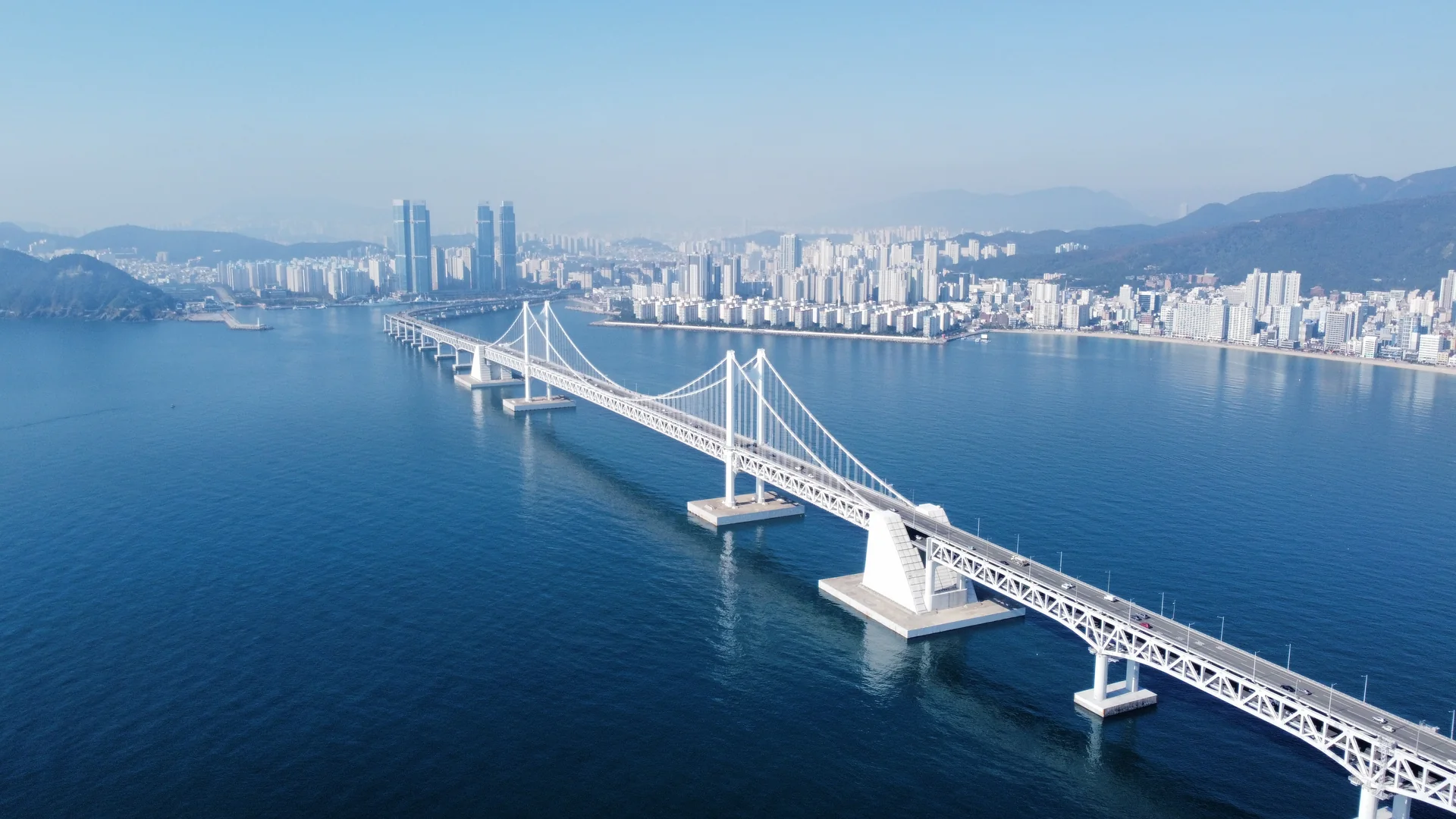 Gwangan Bridge spanning the blue sea in Busan during daylight