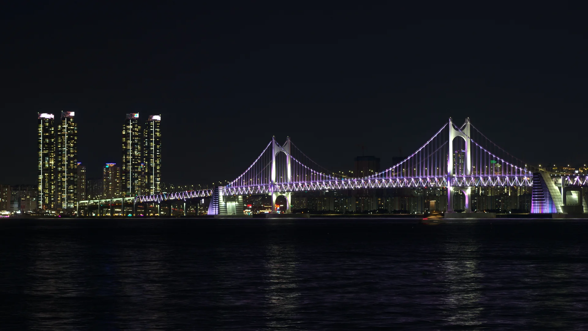 Illuminated Gwangan Bridge seen from Marine City, Busan, at night